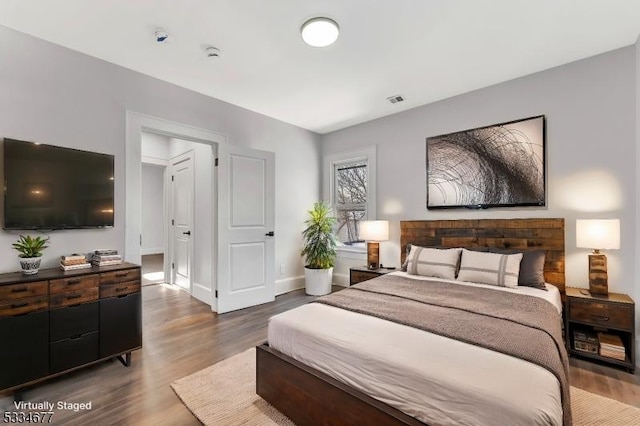 bedroom featuring hardwood / wood-style flooring