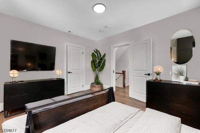 bedroom featuring hardwood / wood-style floors