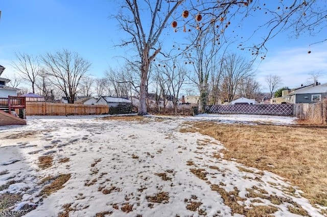 view of yard layered in snow