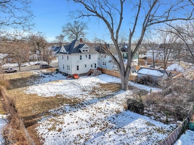 view of yard layered in snow