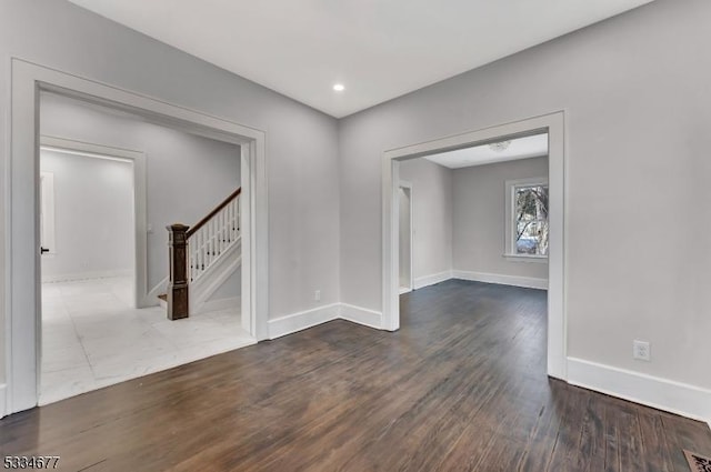 unfurnished room featuring wood-type flooring