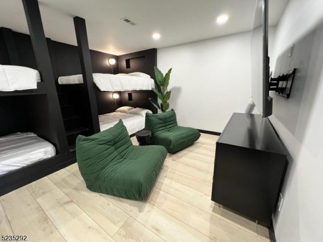 bedroom with light hardwood / wood-style flooring