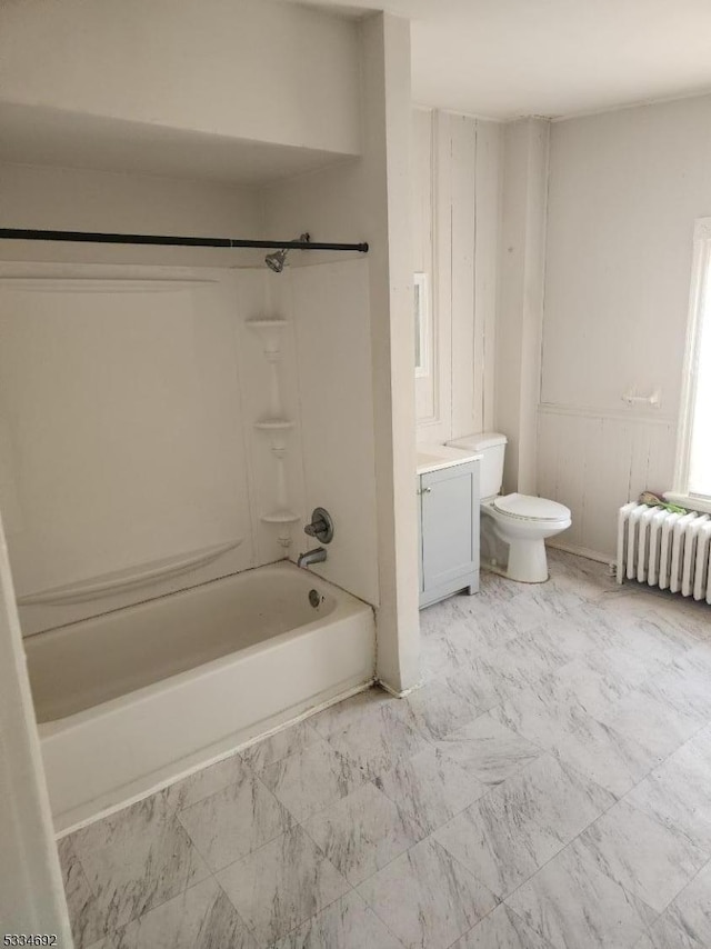 full bathroom with shower / washtub combination, toilet, radiator, and vanity