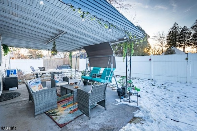 snow covered patio featuring outdoor lounge area