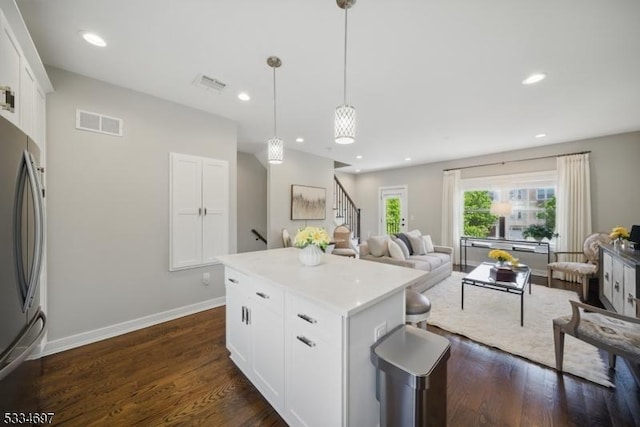 24 Stonybrook Cir, Fairfield Twp, NJ 07004 - kitchen with freestanding refrigerator, open floor plan, a center island, dark wood finished floors, and white cabinetry