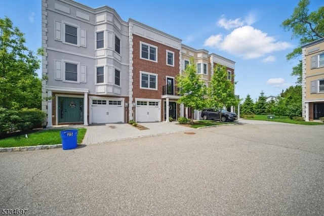 24 Stonybrook Cir, Fairfield Twp, NJ 07004 - view of front facade featuring driveway and an attached garage