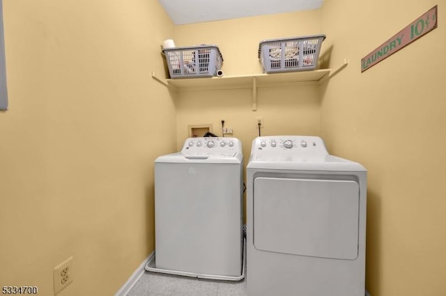 laundry room with separate washer and dryer