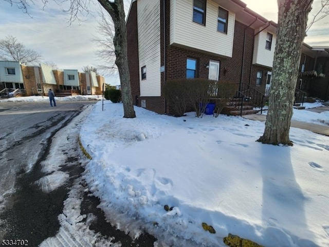 view of snow covered property