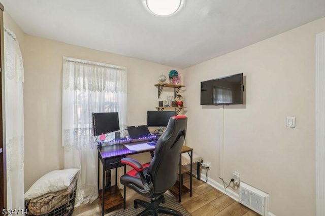 office area with hardwood / wood-style flooring