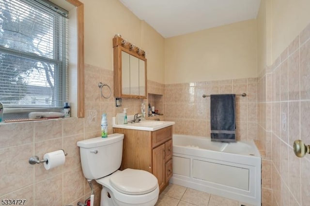 bathroom with tile walls, tile patterned flooring, vanity, a washtub, and toilet