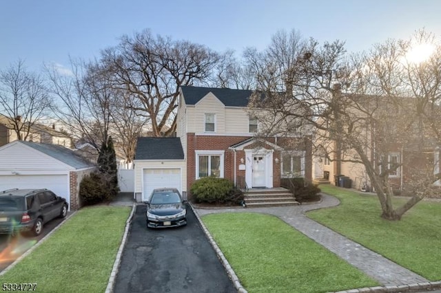 view of property featuring a front lawn