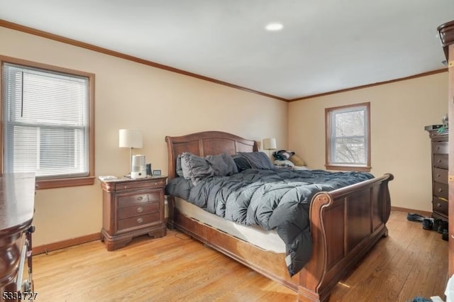 bedroom with ornamental molding and light wood-type flooring