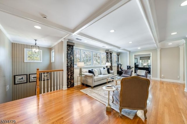 living room with ornate columns, coffered ceiling, beam ceiling, and light wood-type flooring