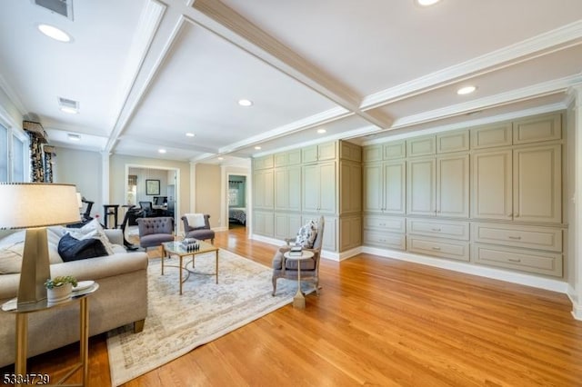 living room featuring coffered ceiling, ornamental molding, light hardwood / wood-style floors, and beamed ceiling