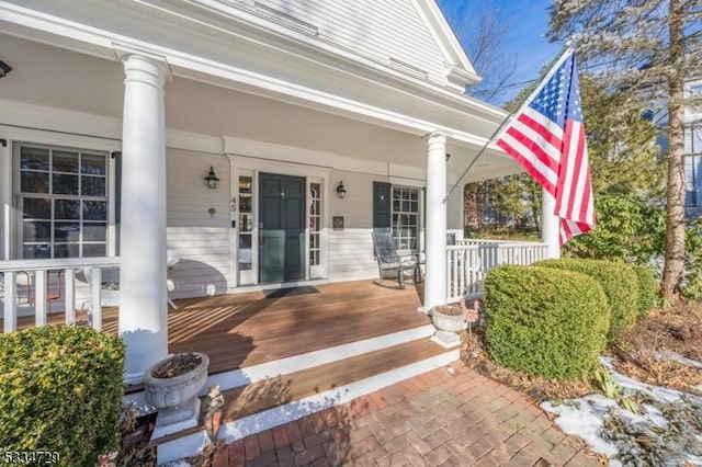 doorway to property with covered porch