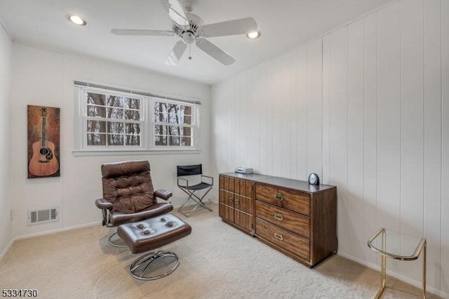 sitting room with light carpet, recessed lighting, visible vents, and ceiling fan