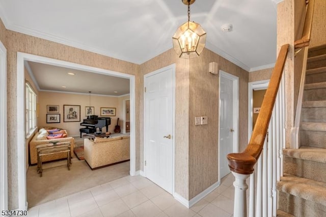 interior space featuring ornamental molding and wallpapered walls