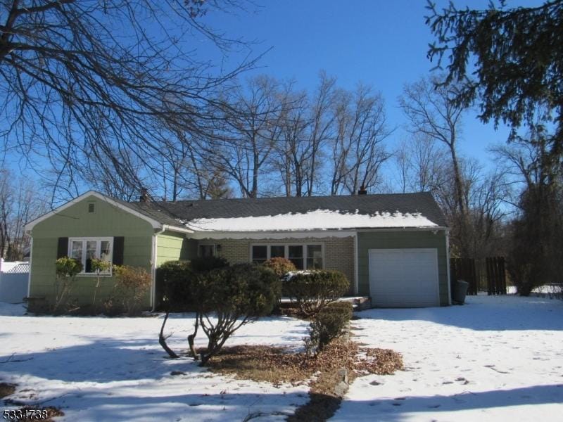 ranch-style home with a garage