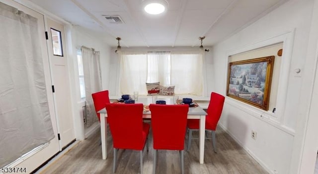 dining room with wood-type flooring