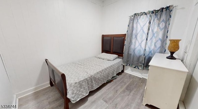 bedroom with light hardwood / wood-style floors