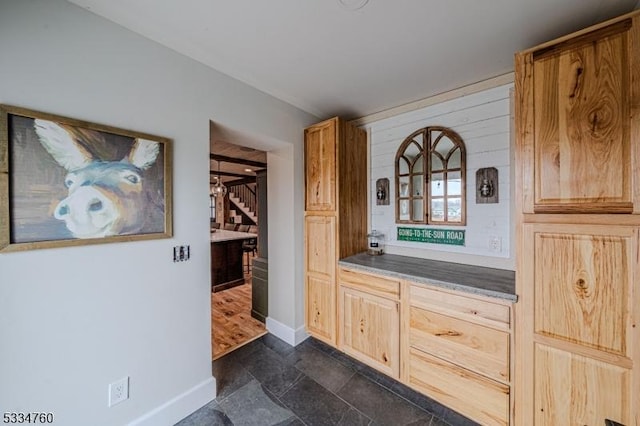 bar with light brown cabinets