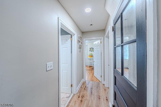 corridor featuring light hardwood / wood-style flooring