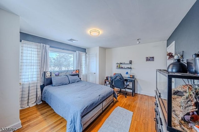 bedroom with light hardwood / wood-style floors