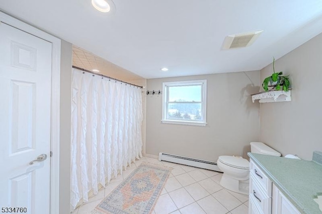 bathroom featuring baseboard heating, vanity, curtained shower, tile patterned floors, and toilet