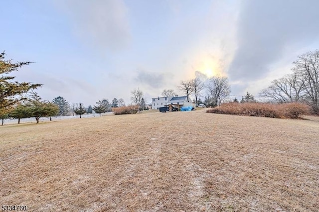 view of yard with a rural view