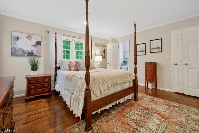 bedroom featuring ornamental molding, wood finished floors, and baseboards