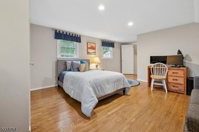 bedroom featuring light wood-style floors, recessed lighting, and baseboards