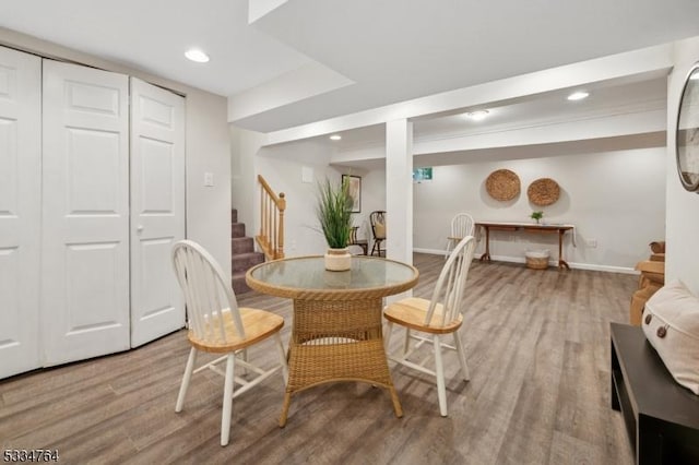 dining space with stairway, wood finished floors, baseboards, and recessed lighting