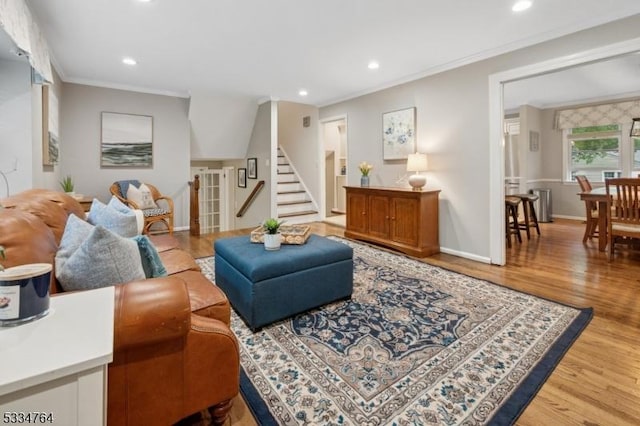 living area featuring crown molding, wood finished floors, stairway, recessed lighting, and baseboards