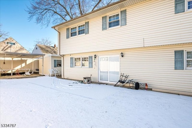 view of snow covered house