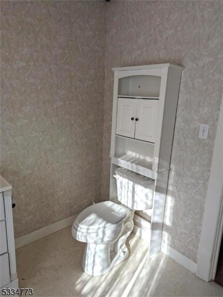 bathroom with tile patterned floors and toilet