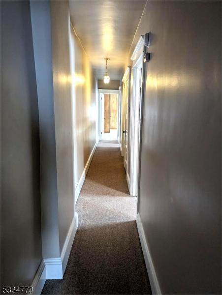 corridor with carpet floors