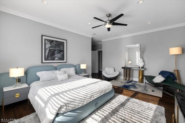 bedroom with ceiling fan, ornamental molding, and dark hardwood / wood-style flooring