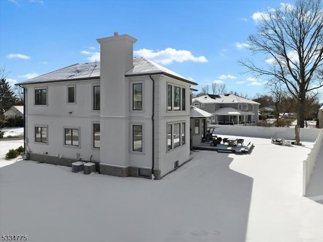 view of snow covered house