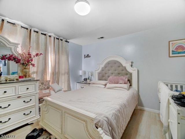 bedroom featuring light hardwood / wood-style floors