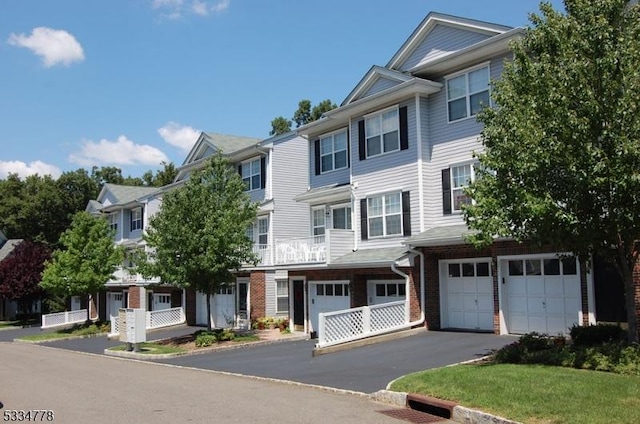 multi unit property featuring a garage