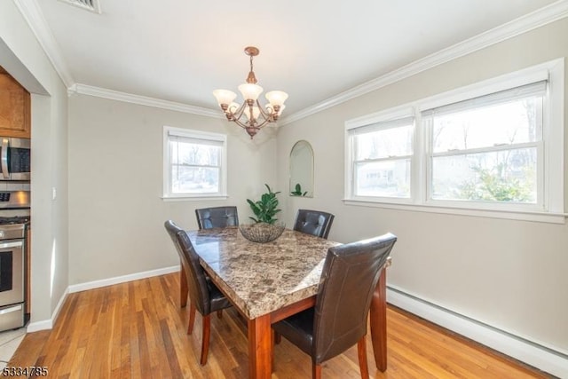 dining room featuring crown molding, a baseboard heating unit, an inviting chandelier, and light hardwood / wood-style flooring