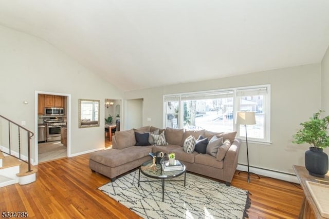 living room featuring wood-type flooring, a baseboard radiator, and vaulted ceiling