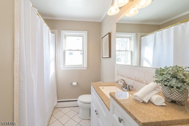 bathroom with tile patterned floors, toilet, crown molding, baseboard heating, and vanity