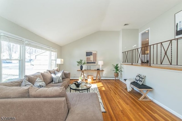 living room with lofted ceiling and wood-type flooring