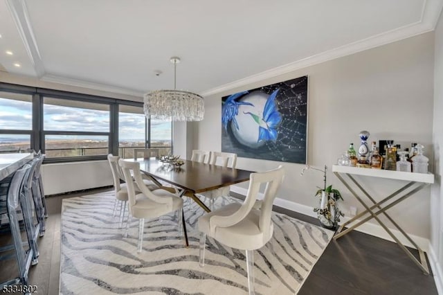 dining room featuring crown molding and hardwood / wood-style floors