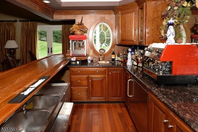 bar with butcher block counters, sink, dishwashing machine, and dark hardwood / wood-style floors