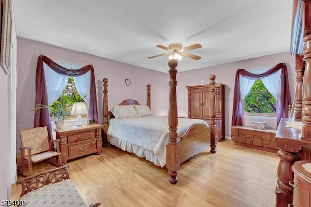 bedroom featuring light wood-type flooring and a ceiling fan