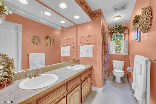 bathroom with toilet, double vanity, tile patterned flooring, curtained shower, and recessed lighting