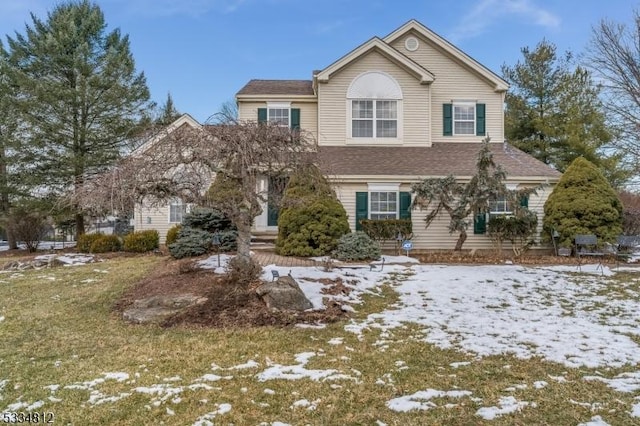 view of front property with a yard