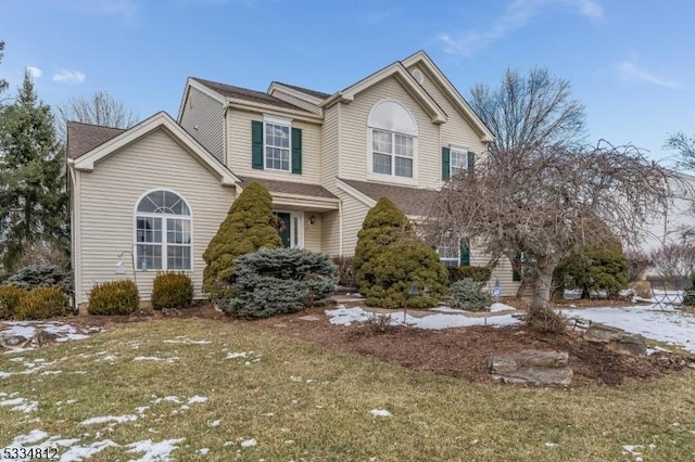 front of property featuring a lawn